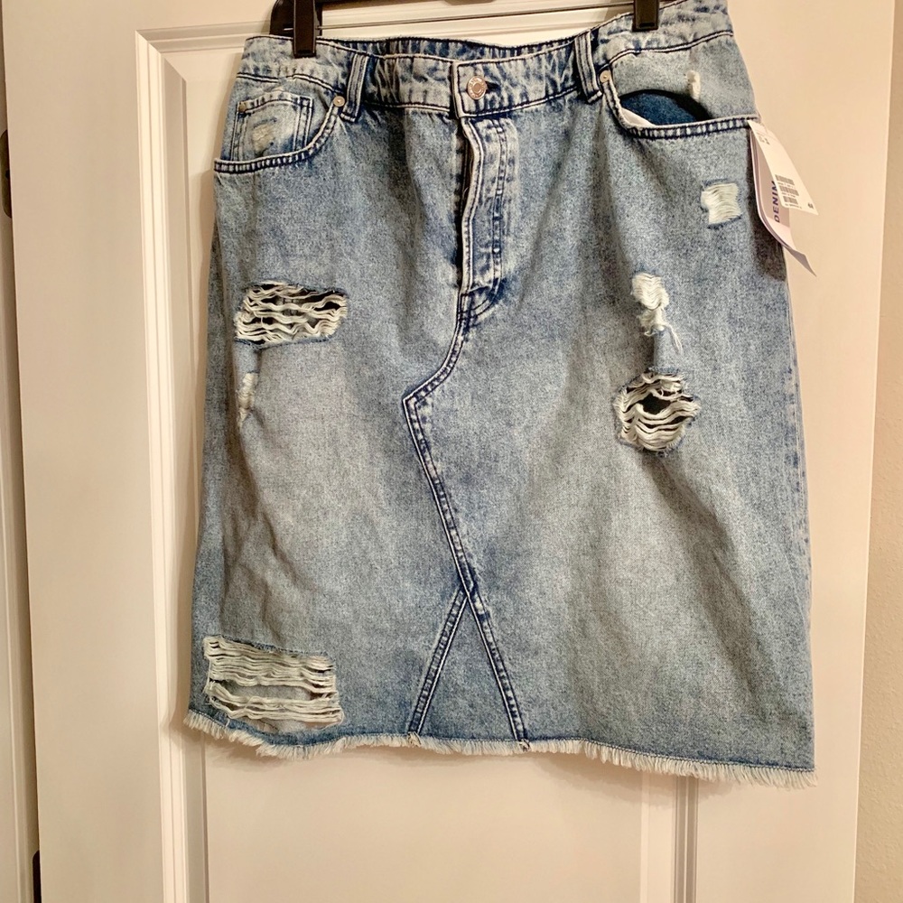Distressed denim skirt.